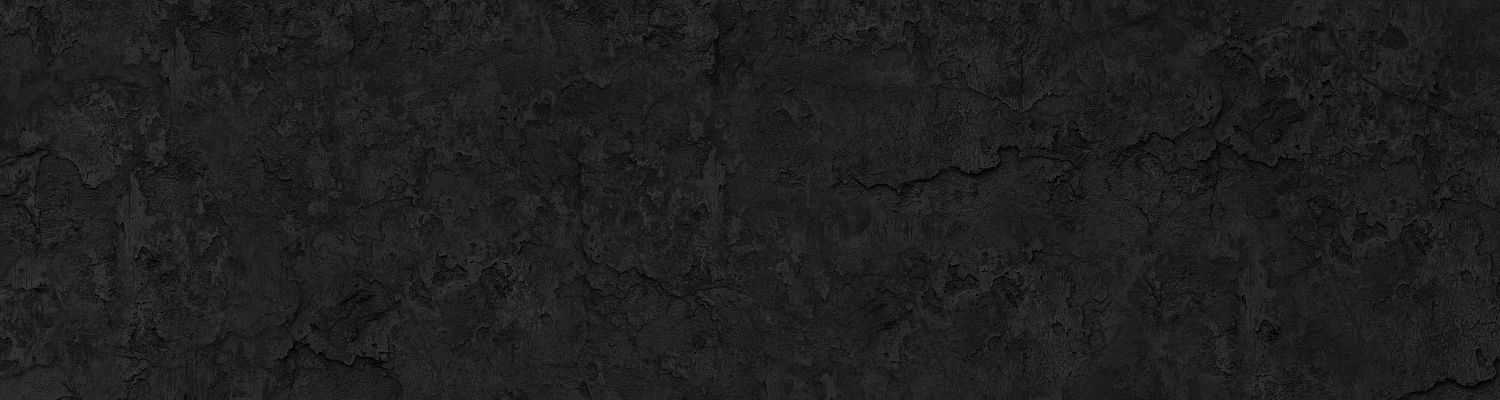 Dark textured stone wall with a rough, uneven surface pattern.